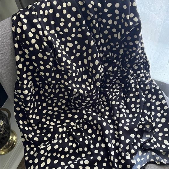 2 dresses. Black Polka Dot Tiered Dress & Solid Black Ruffle Hem Dress - Picture 4 of 7